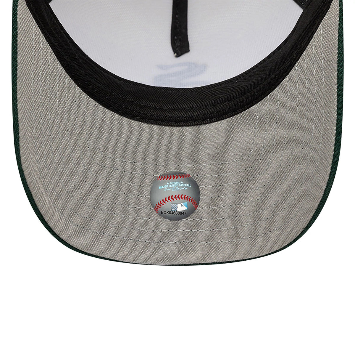 Chicago White Sox Chrome White And Dark Green New Era 9FORTY A-Frame Adjustable Cap, inside view showing a light grey undervisor with a holographic MLB sticker, and a black sweatband with contrasting white taping.