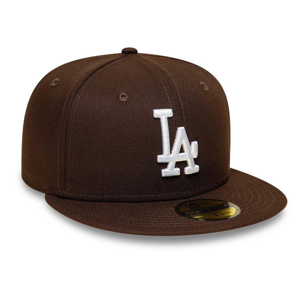 LA Dodgers MLB Dark Brown New Era 59FIFTY Fitted Cap, front view showing the white raised LA logo embroidered on the brown structured crown, with a flat brown visor featuring a gold 59FIFTY size sticker on the top.