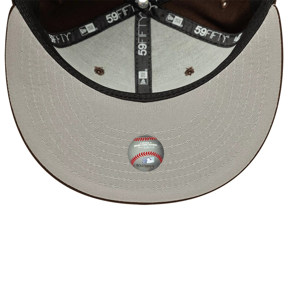 LA Dodgers MLB Dark Brown New Era 59FIFTY Fitted Cap, inside view showing black 59FIFTY taping along the seams, a black sweatband around the interior, and a silver undervisor with an MLB baseball sticker at the centre.