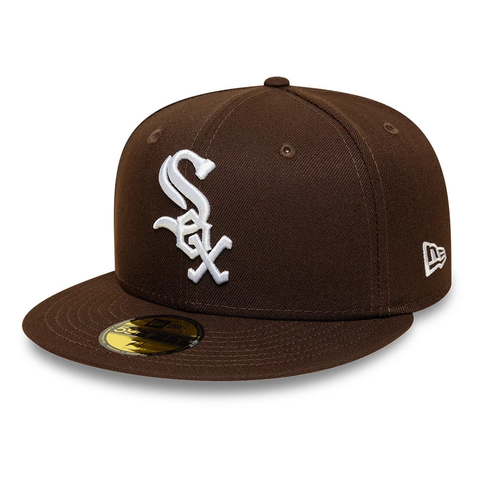 Chicago White Sox MLB Dark Brown New Era 59FIFTY Fitted Cap, three-quarter view showing the raised white embroidered Sox logo on the front panel, a matching dark brown visor with a gold 59FIFTY size sticker.