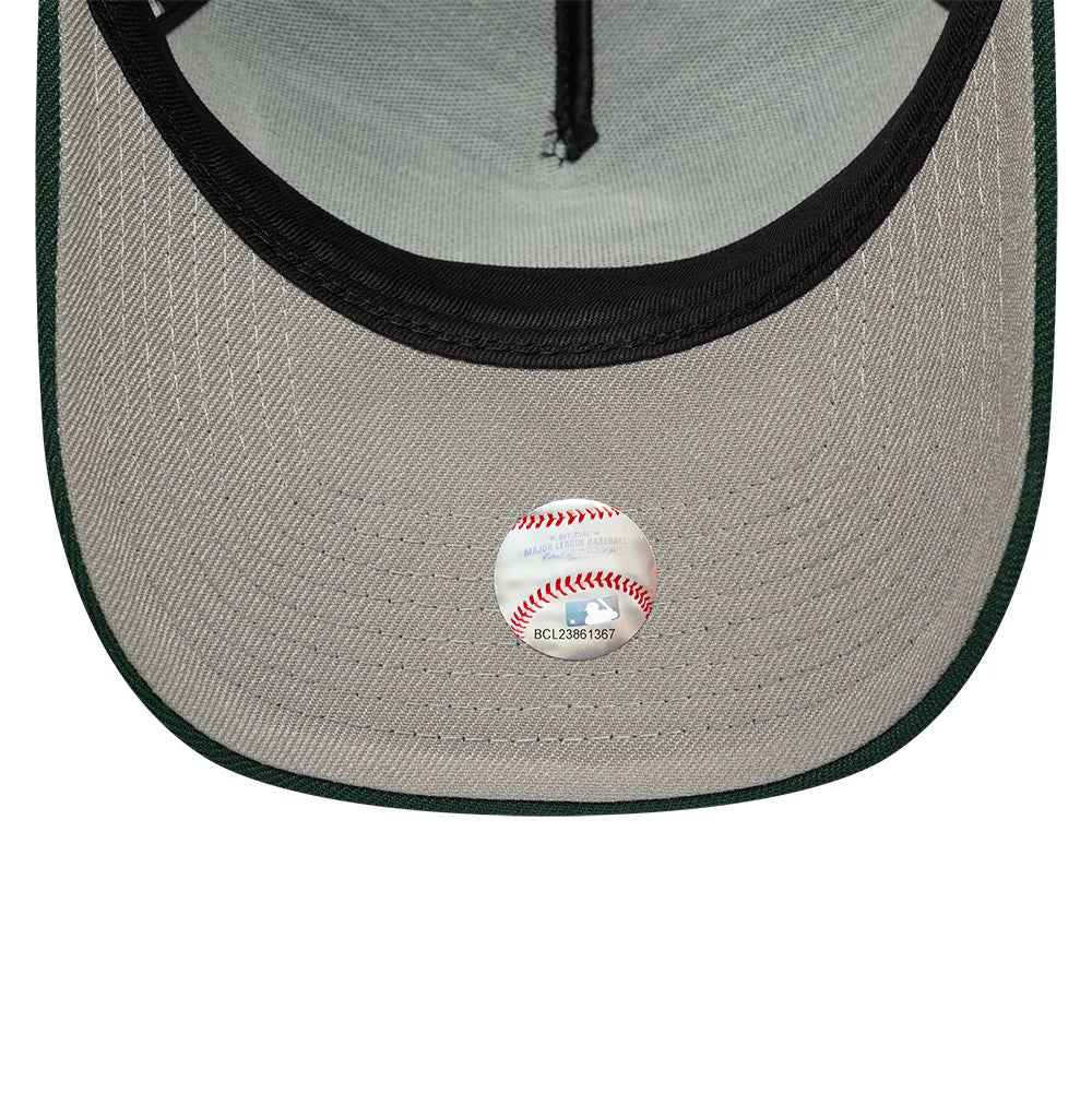 Chicago White Sox MLB Dark Green New Era 9FORTY A-Frame Adjustable Cap, inside view showing the grey undervisor with a black sweatband, MLB holographic sticker at the centre, and green stitching along the edge.