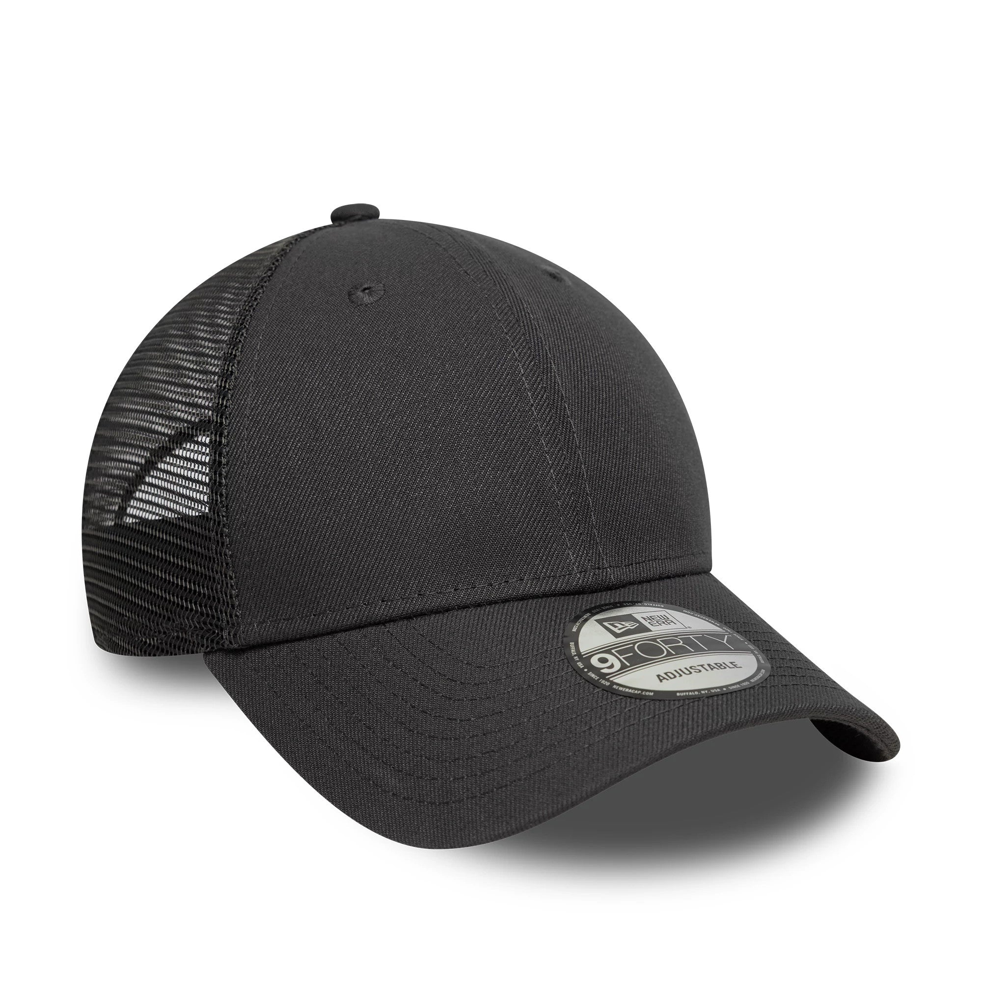 New Era Grey 9FORTY Trucker Adjustable Cap, three-quarter view showing a black mesh back with curved grey visor and a 9FORTY size sticker on the front panels, featuring a structured front crown and embroidered eyelets.