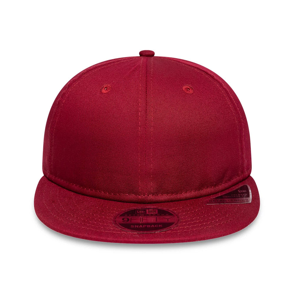 New Era Red Retro Crown 9FIFTY Snapback Adjustable Cap, front view showing the plain red front panel and eyelets, with a slightly curved visor featuring a 9FIFTY size sticker prominently placed at the top.