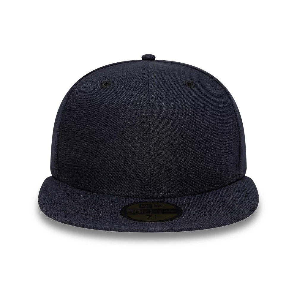 New Era Navy 59FIFTY Fitted Cap, front view showing the solid navy crown with no front logo, complemented by a flat navy visor adorned with a gold 59FIFTY size sticker at the centre, with matching embroidered eyelets.