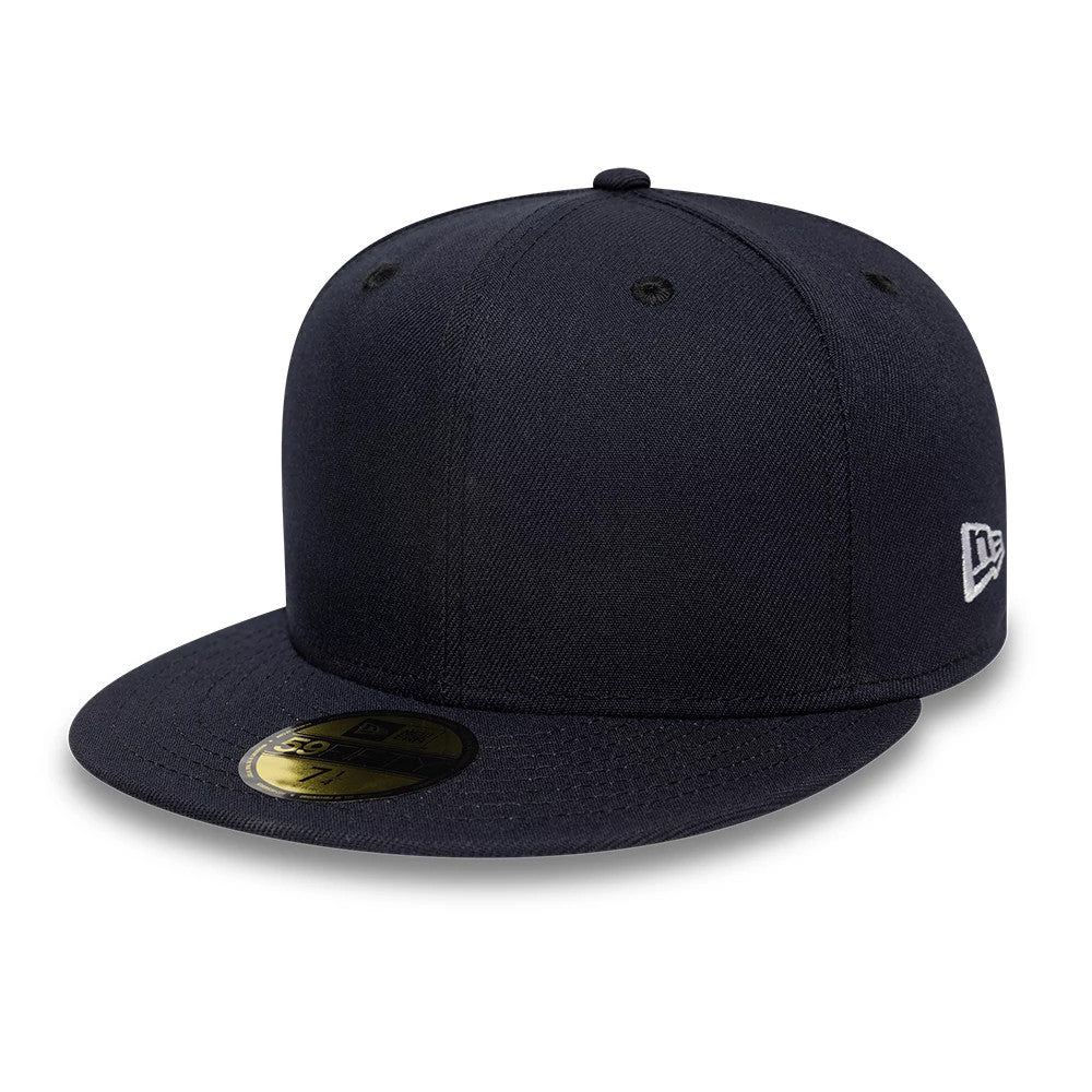 New Era Navy 59FIFTY Fitted Cap, three-quarter view showing a structured navy crown, a curved visor with a gold 59FIFTY size sticker, and the distinctive white New Era flag logo embroidered on the left side.