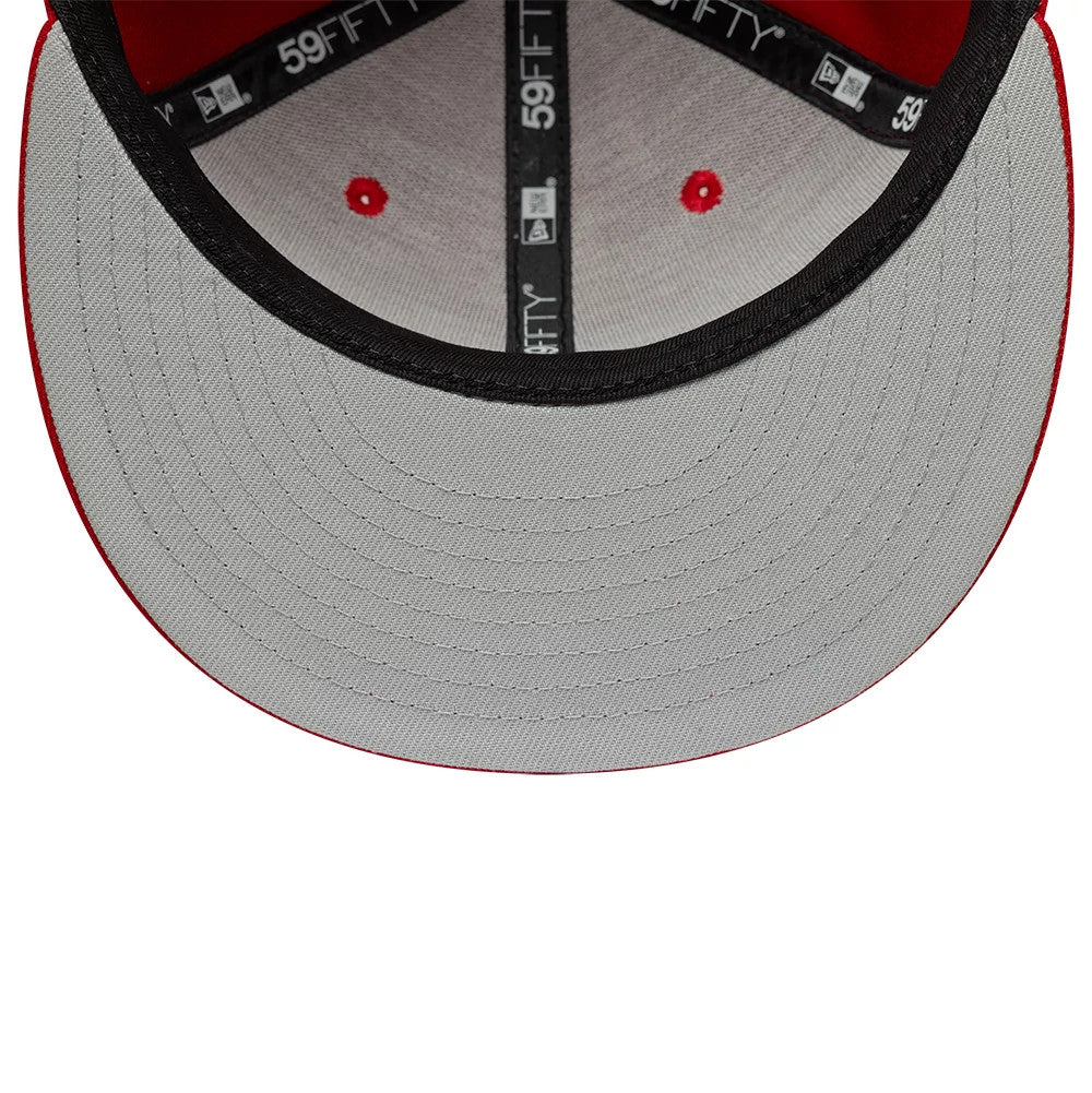 New Era Red 59FIFTY Fitted Cap, inside view showcasing a grey undervisor and black sweatband with branded taping, red fabric eyelets accentuating each panel, and a red interior lining for contrasting detail.