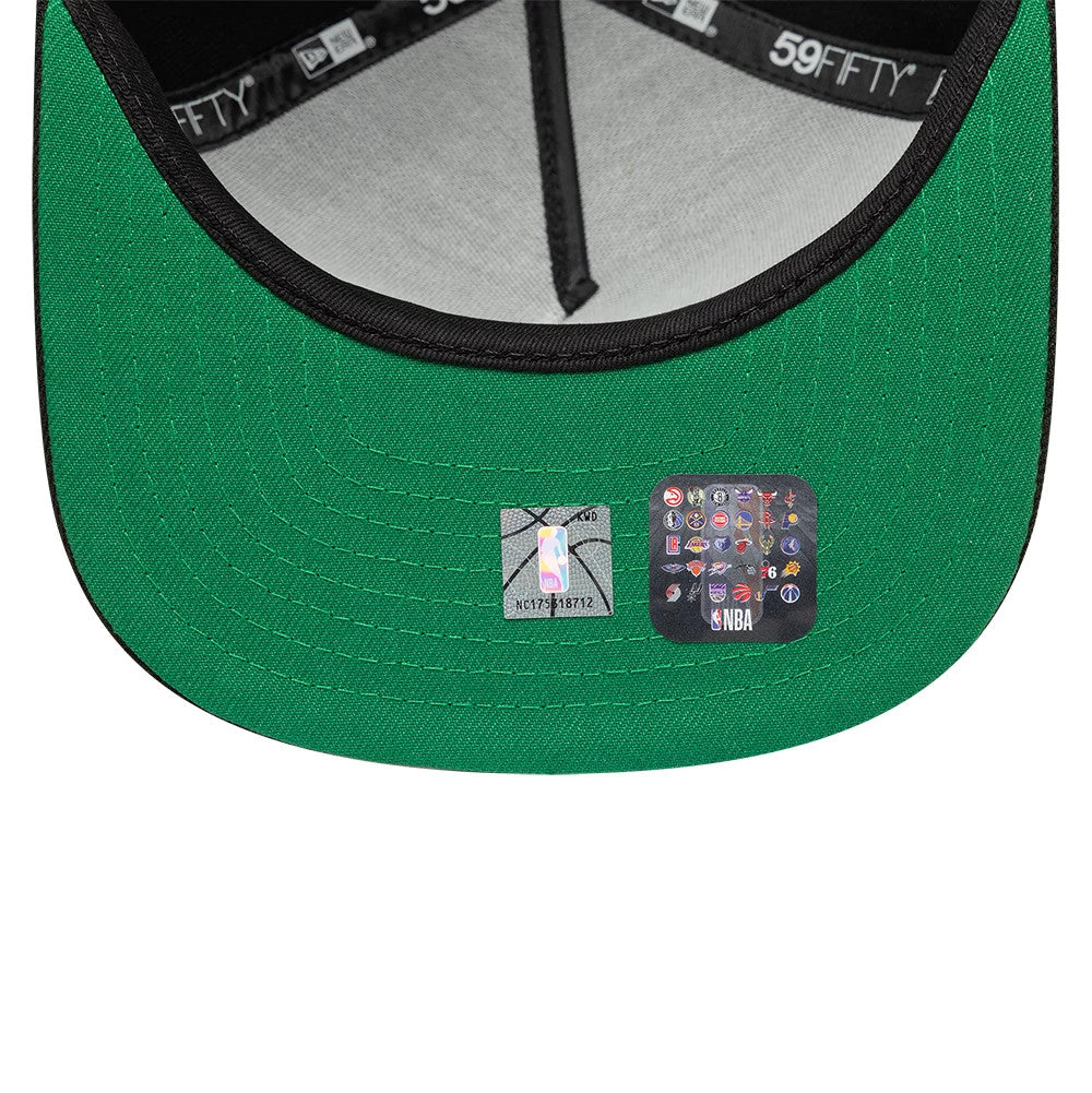 LA Lakers NBA Flat Black New Era 59FIFTY A-Frame Fitted Cap, inside view showing the green undervisor with dual stickers featuring an NBA logo and team icons, contrasting black taping and a grey crown interior.