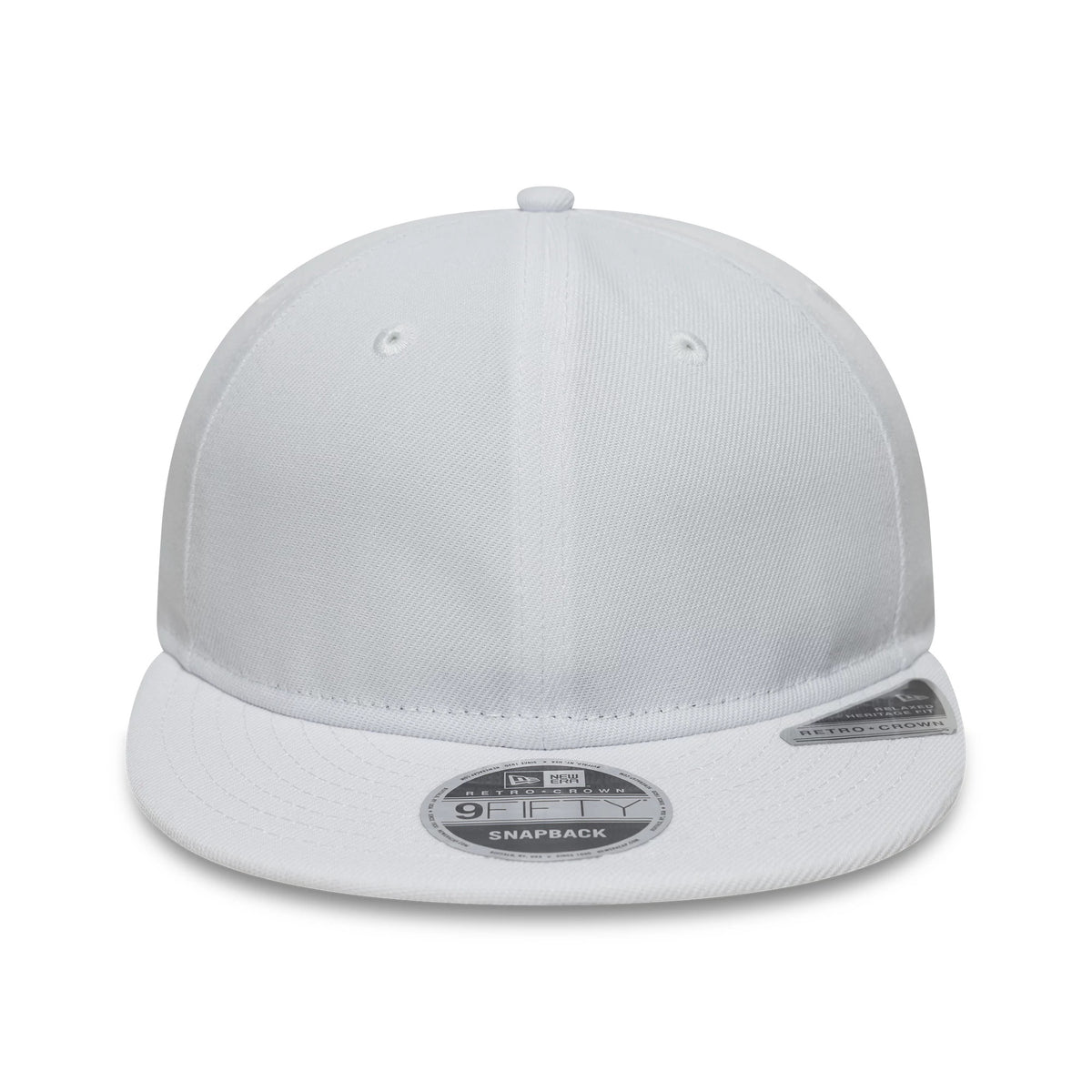 New Era White Retro Crown 9FIFTY Snapback Adjustable Cap, front view showing the crisp white fabric, a structured crown with embroidered eyelets, and a matching white visor featuring the 9FIFTY size sticker prominently displayed on top.