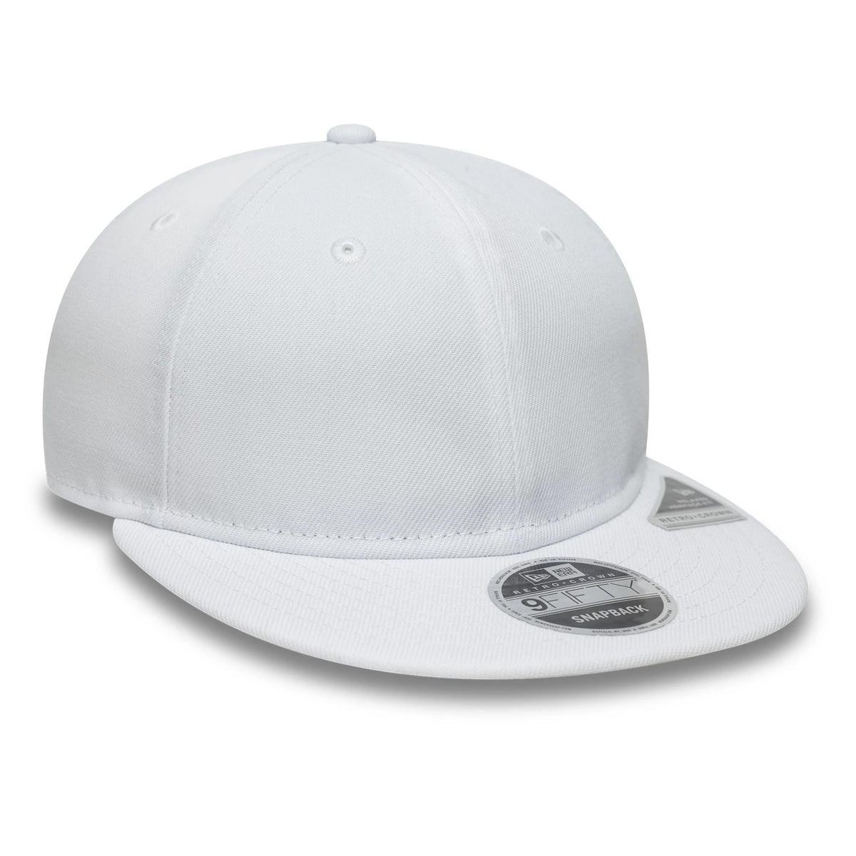 New Era White Retro Crown 9FIFTY Snapback Adjustable Cap, three-quarter view showing a white structured crown with matching white visor and top button, featuring a silver 9FIFTY size sticker on the visor and centred eyelets.