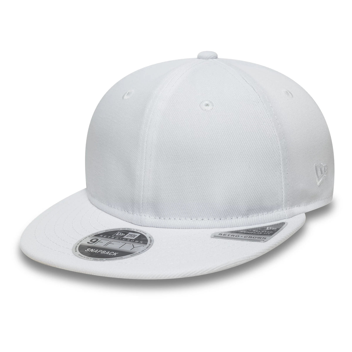 New Era White Retro Crown 9FIFTY Snapback Adjustable Cap, three-quarter view showing a classic white structured crown, flat visor with the 9FIFTY size sticker, and the New Era flag logo embroidered on the left side.