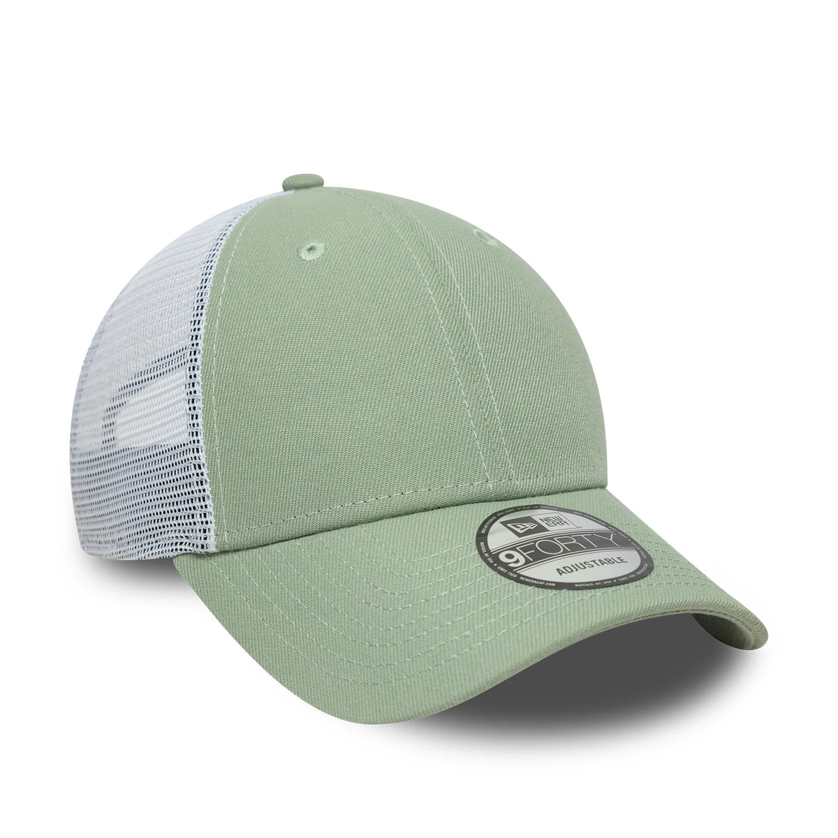 New Era Green 9FORTY Trucker Adjustable Cap, three-quarter view showing the black and white 9FORTY size sticker on the pale green curved visor, light green front panel with two eyelets, and white mesh back panels.