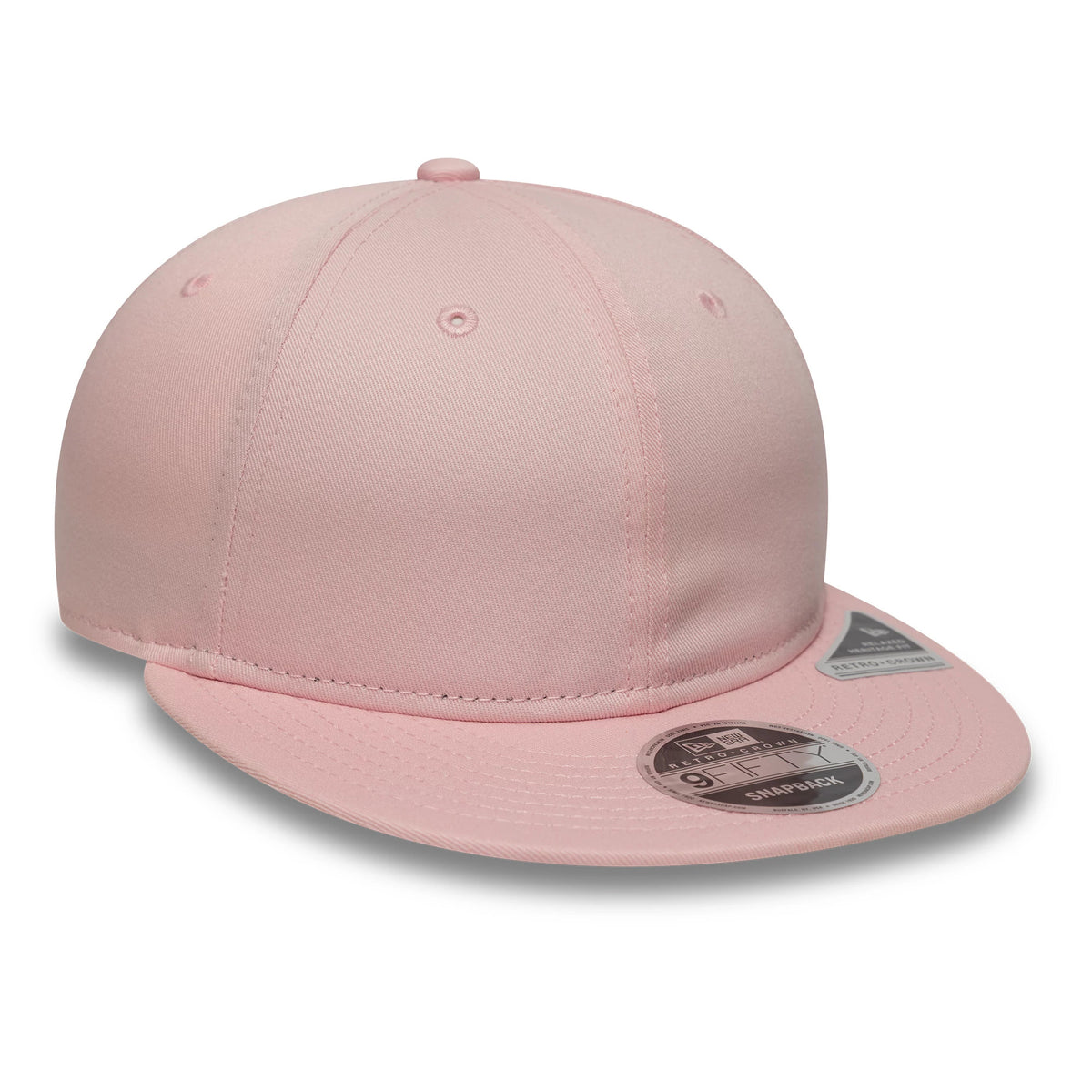 New Era Pink Retro Crown 9FIFTY Snapback Adjustable Cap, three-quarter view showing the pink structured crown with matching eyelets and top button, along with a flat pink visor displaying the 9FIFTY size sticker and a visor sticker on top.