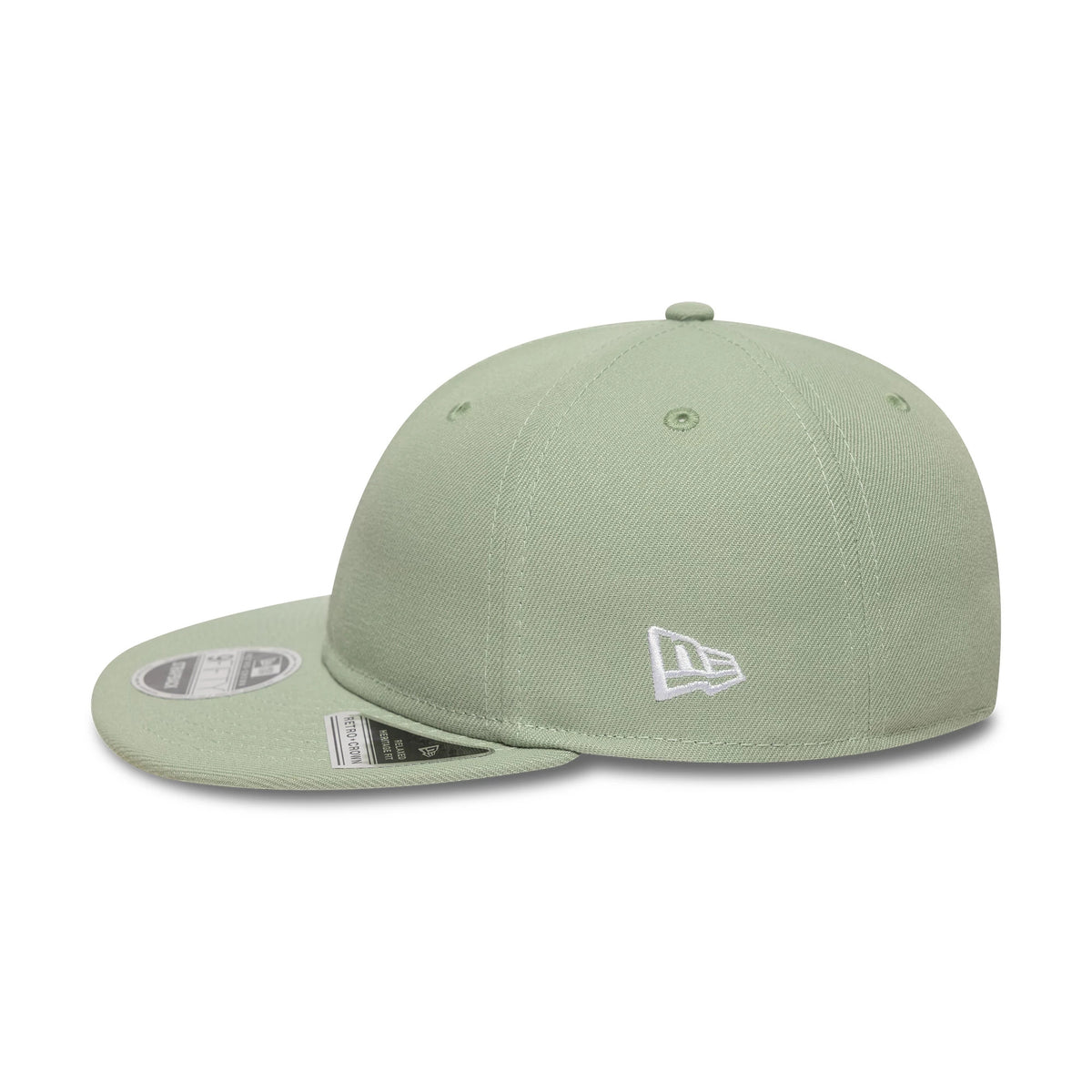 New Era Green Retro Crown 9FIFTY Snapback Adjustable Cap, three-quarter view showing a white New Era flag logo on the left side of the structured green crown, with a flat visor featuring a 9FIFTY size sticker placed on the top.