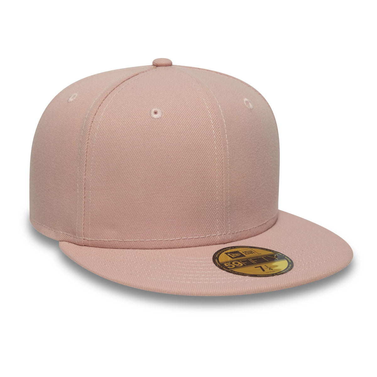 New Era Blank Pink 59FIFTY Fitted Cap, three-quarter view showing the plain pink structured crown with matching eyelets and top button, a flat pink visor, and a gold 59FIFTY size sticker on the visor.