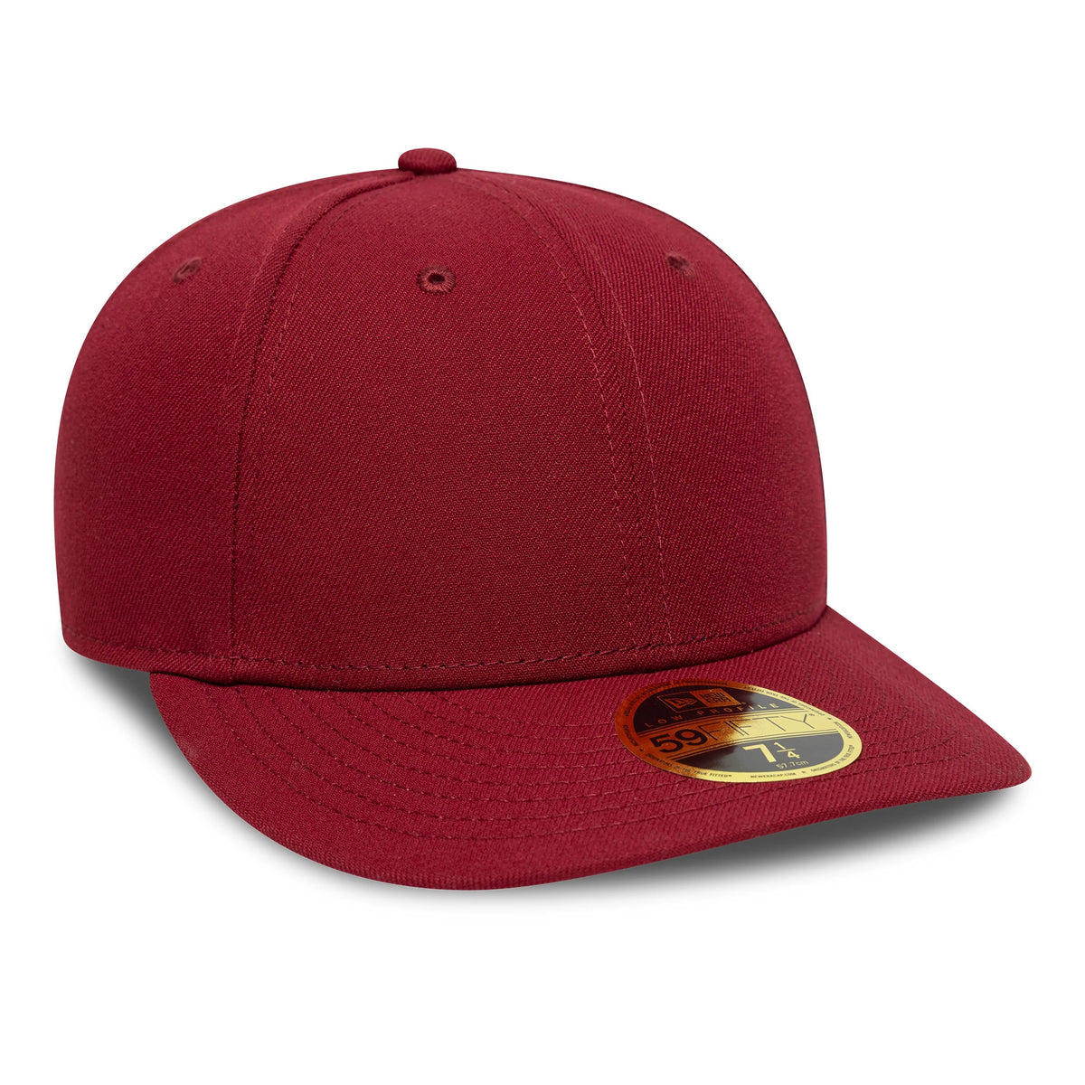 New Era Dark Red Low Profile 59FIFTY Fitted Cap, three-quarter view showing a deep red structured crown, matching visor, and a gold 59FIFTY size sticker on the visor, with embroidered eyelets and top button.