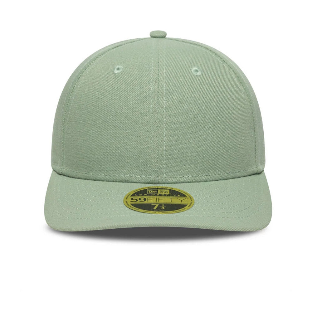 New Era Green Low Profile 59FIFTY Fitted Cap, front view showing the seamless construction with a structured mint green crown and matching stitching, along with the gold 59FIFTY size sticker centred on the curved visor.