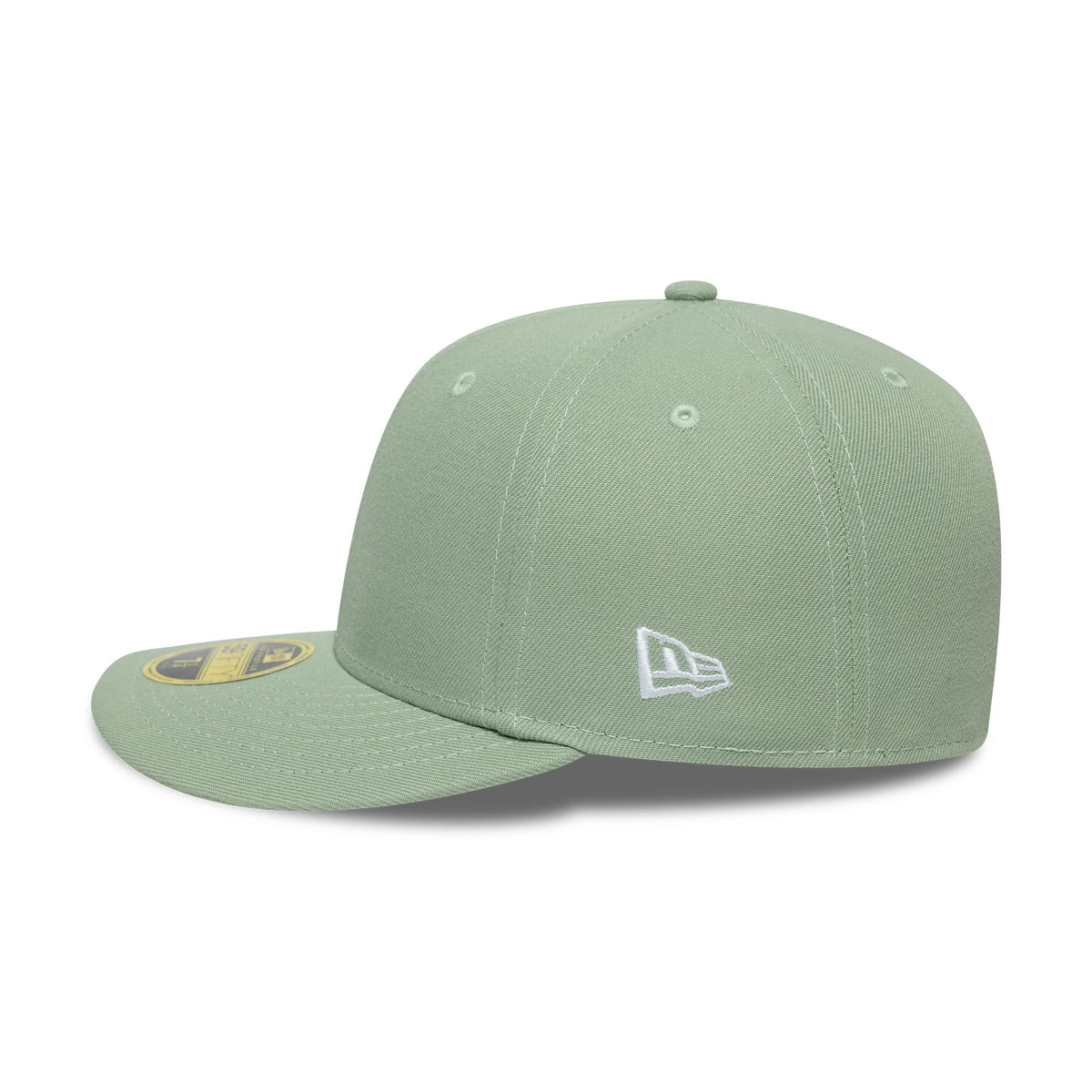 New Era Green Low Profile 59FIFTY Fitted Cap, three-quarter view showing the white embroidered New Era flag logo on the left side, a flat green visor with a gold 59FIFTY size sticker, and a soft-structured crown with matching green eyelets.