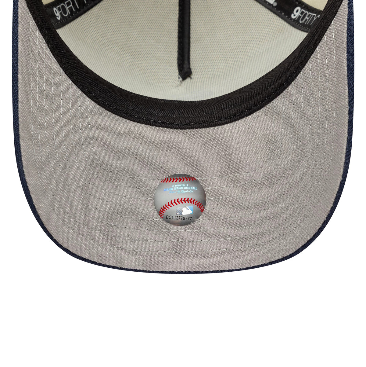 Chicago White Sox MLB Chrome Blue Contrast Cream New Era 9FORTY A-Frame Adjustable Cap, inside view showing the grey undervisor with a baseball graphic sticker, black interior sweatband, and cream panel taping.