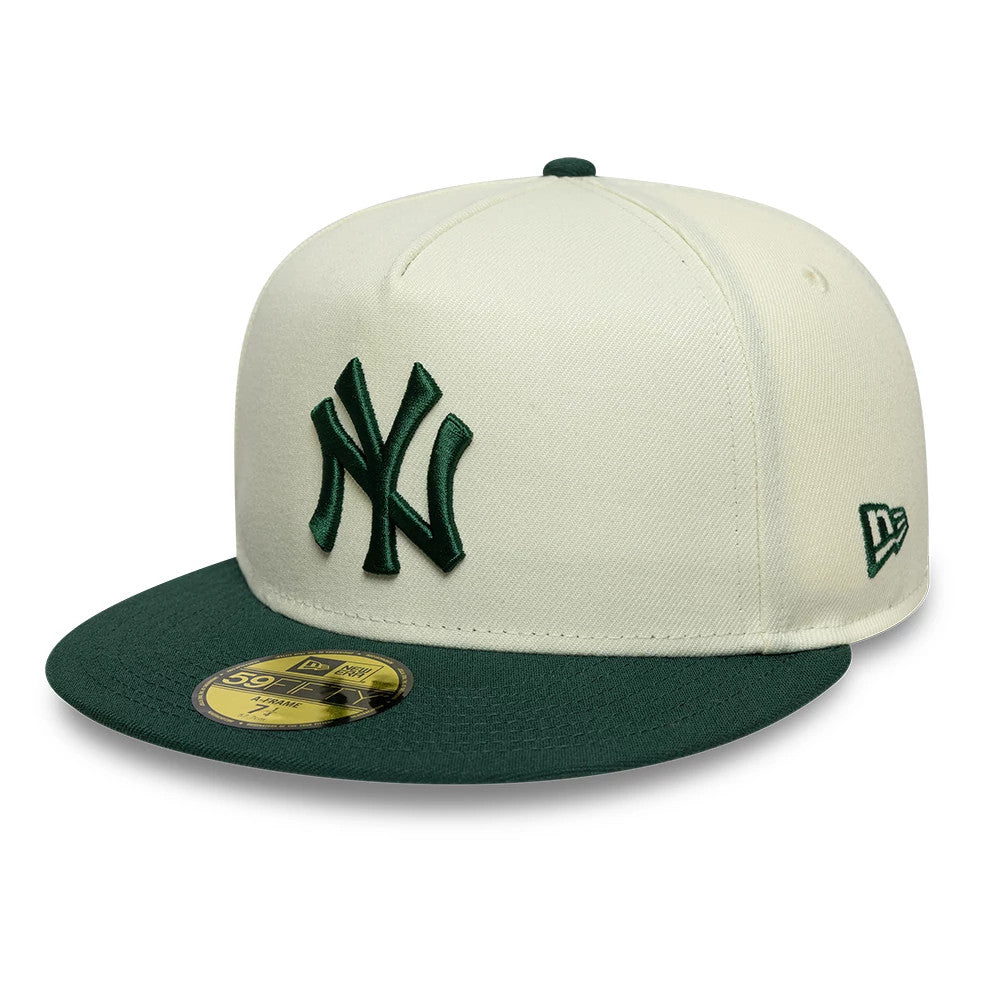 New York Yankees MLB Cream New Era 59FIFTY A-Frame Fitted Cap, three-quarter view showing a raised dark green embroidered NY logo on the front cream panel, a matching green flat visor with a gold 59FIFTY size sticker.