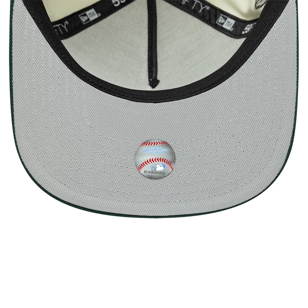 New York Yankees MLB Cream New Era 59FIFTY A-Frame Fitted Cap, inside view showing the grey undervisor with a baseball sticker at the centre, black sweatband with branded taping, and cream interior lining.