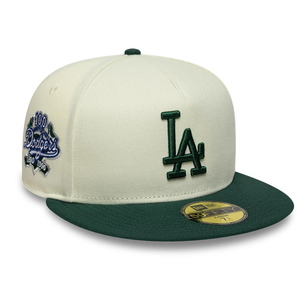 LA Dodgers MLB Cream New Era 59FIFTY A-Frame Fitted Cap, front view showing a dark green embroidered LA logo on the cream front panel, a dark green flat visor with a gold 59FIFTY size sticker, and a blue Dodgers anniversary patch on the side.