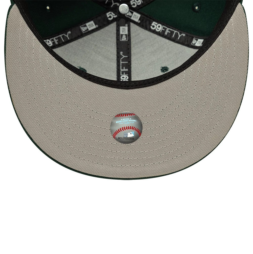 LA Dodgers MLB Dark Green New Era 59FIFTY Fitted Cap, inside view showing grey undervisor with a baseball design sticker, black New Era branded taping with white 59FIFTY embroidery, and a dark green sweatband edge.