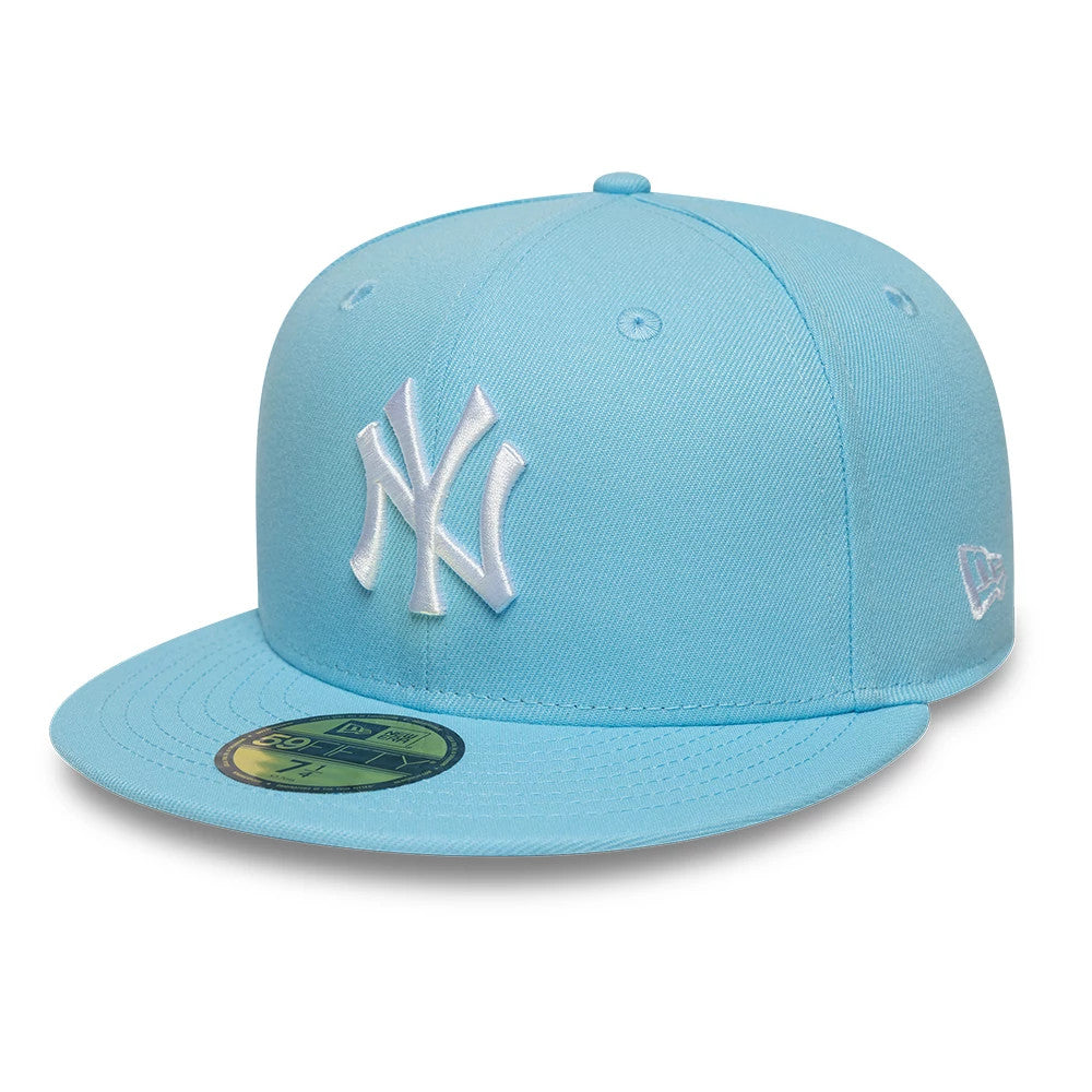 New York Yankees MLB Pastel Blue New Era 59FIFTY Fitted Cap, three-quarter view showing the raised white embroidered NY logo on the front panel, pastel blue flat visor with a gold 59FIFTY size sticker, and New Era flag logo on the left side.