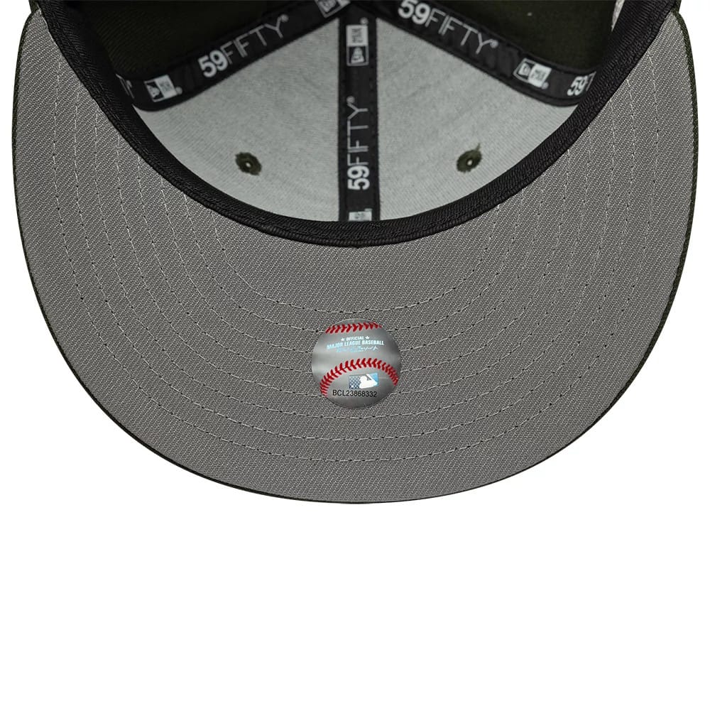 Chicago White Sox MLB Sidepatch Dark Green New Era 59FIFTY Fitted Cap, inside view showing the grey undervisor with a detailed baseball print sticker, black sweatband featuring multiple white 59FIFTY logos.
