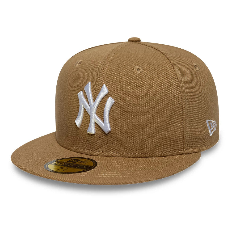 New York Yankees MLB Beige New Era 59FIFTY Fitted Cap, front view showing the white raised embroidered NY logo on the front panel, matching beige visor with a gold 59FIFTY size sticker, and New Era flag logo on the left side.