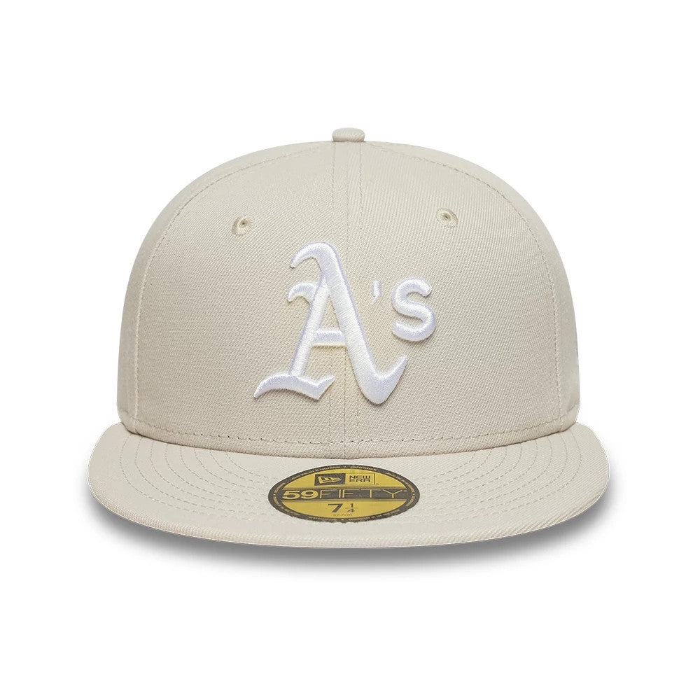 Athletics MLB Beige New Era 59FIFTY Fitted Cap, front view showing the raised white embroidered A's logo on the structured beige crown, with a matching beige flat visor and a gold 59FIFTY size sticker on the top.