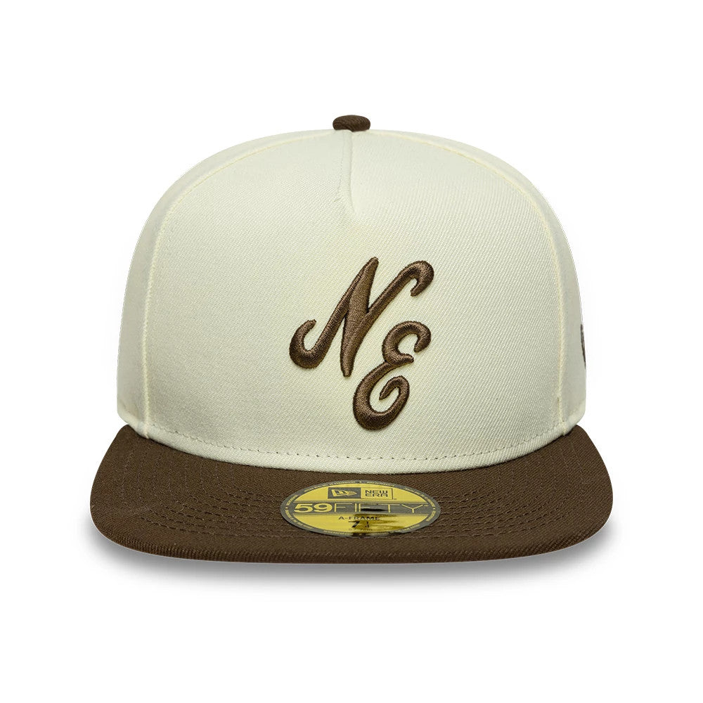 New Era Cream 59FIFTY A-Frame Fitted Cap, front view showing brown embroidered NE lettering on the structured cream crown, brown flat visor, and a gold 59FIFTY size sticker placed centrally on the visor.