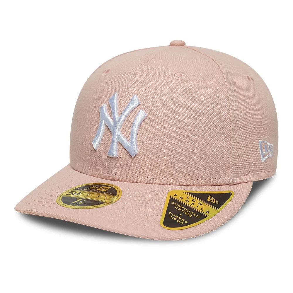 New York Yankees MLB Pastel Pink Low Profile New Era 59FIFTY Fitted Cap, three-quarter view showing the white embroidered NY logo on the front panel, pink curved visor with gold 59FIFTY size sticker, and New Era flag logo on the left side.