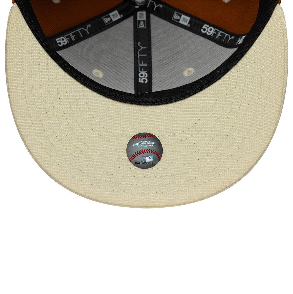 New York Yankees MLB Contrast Brown New Era 59FIFTY Fitted Cap, inside view showing the beige undervisor with an MLB holographic sticker, dark taping with white branding, and interior panels revealing brown and black contrasting elements.