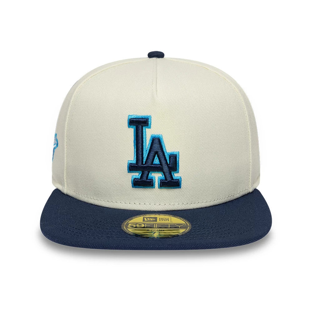 LA Dodgers MLB White New Era 59FIFTY A-Frame Fitted Cap, front view showing the LA logo in blue raised embroidery on the structured white crown, a navy flat visor, and a gold 59FIFTY size sticker centred on the visor.