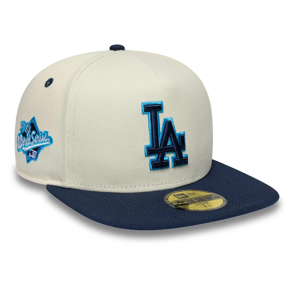 LA Dodgers MLB White New Era 59FIFTY A-Frame Fitted Cap, front view showing the raised blue embroidered LA logo on the white crown, with a navy flat visor and a gold 59FIFTY size sticker, plus a World Series side patch.