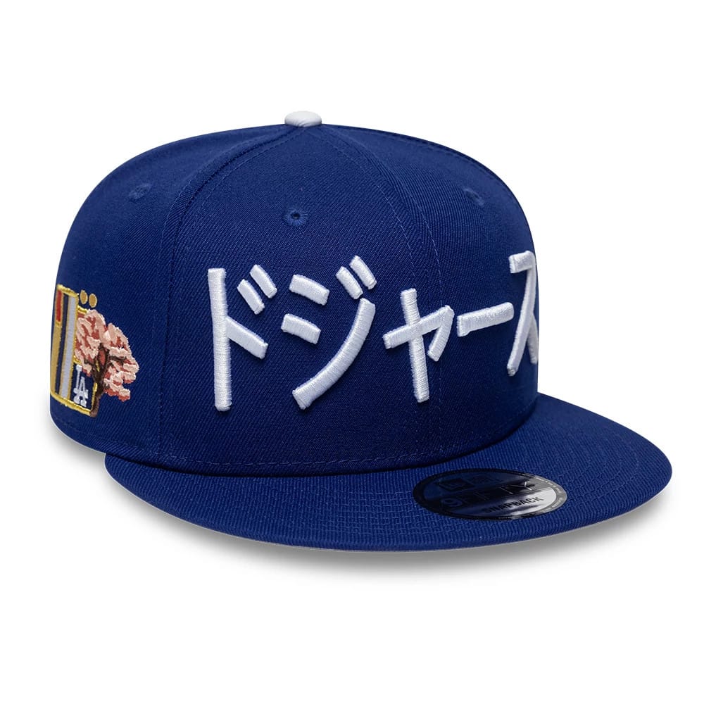 Pictured is this MLB Kanji LA Dodgers 9FIFTY Snapback Adjustable cap in dark blue. 1