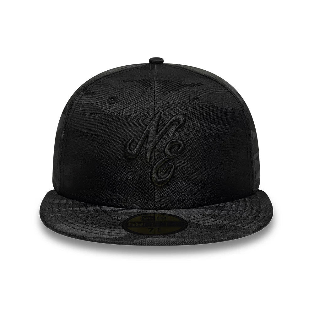 New Era Camo Black 59FIFTY Fitted Cap, front view showing a raised black NE logo embroidered on the structured black camo-patterned crown, with matching camo flat visor and a gold 59FIFTY size sticker on the visor.