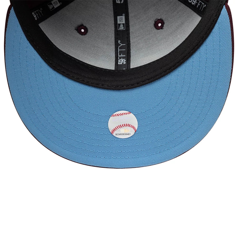 Pictured is this MLB Floral New York Yankees 59FIFTY Fitted cap in dark purple. 2