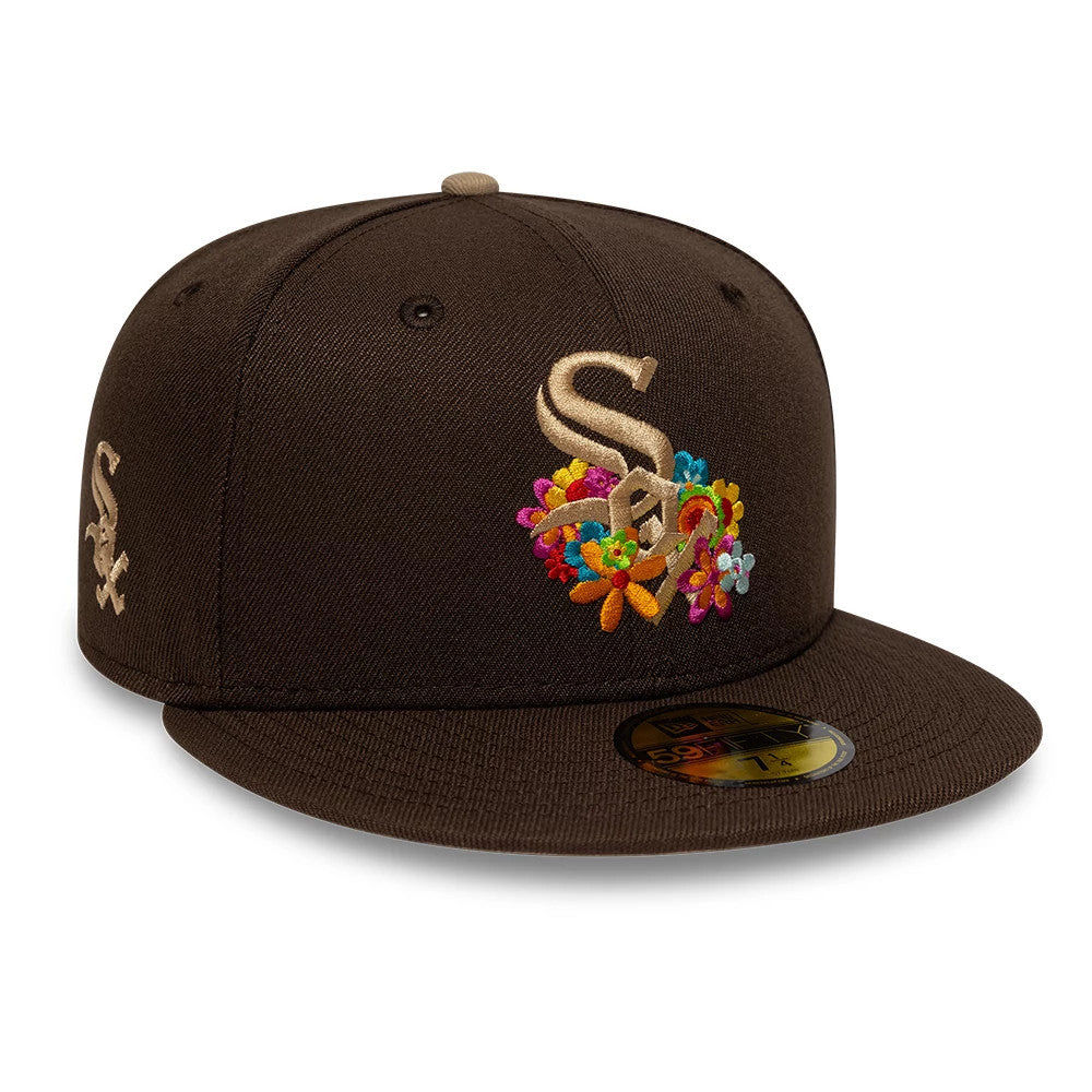 Chicago White Sox MLB Floral Dark Brown New Era 59FIFTY Fitted Cap, three-quarter view showing the raised gold Sox logo with multicoloured floral embroidery on the front panel, brown flat visor, and gold 59FIFTY size sticker on the visor.