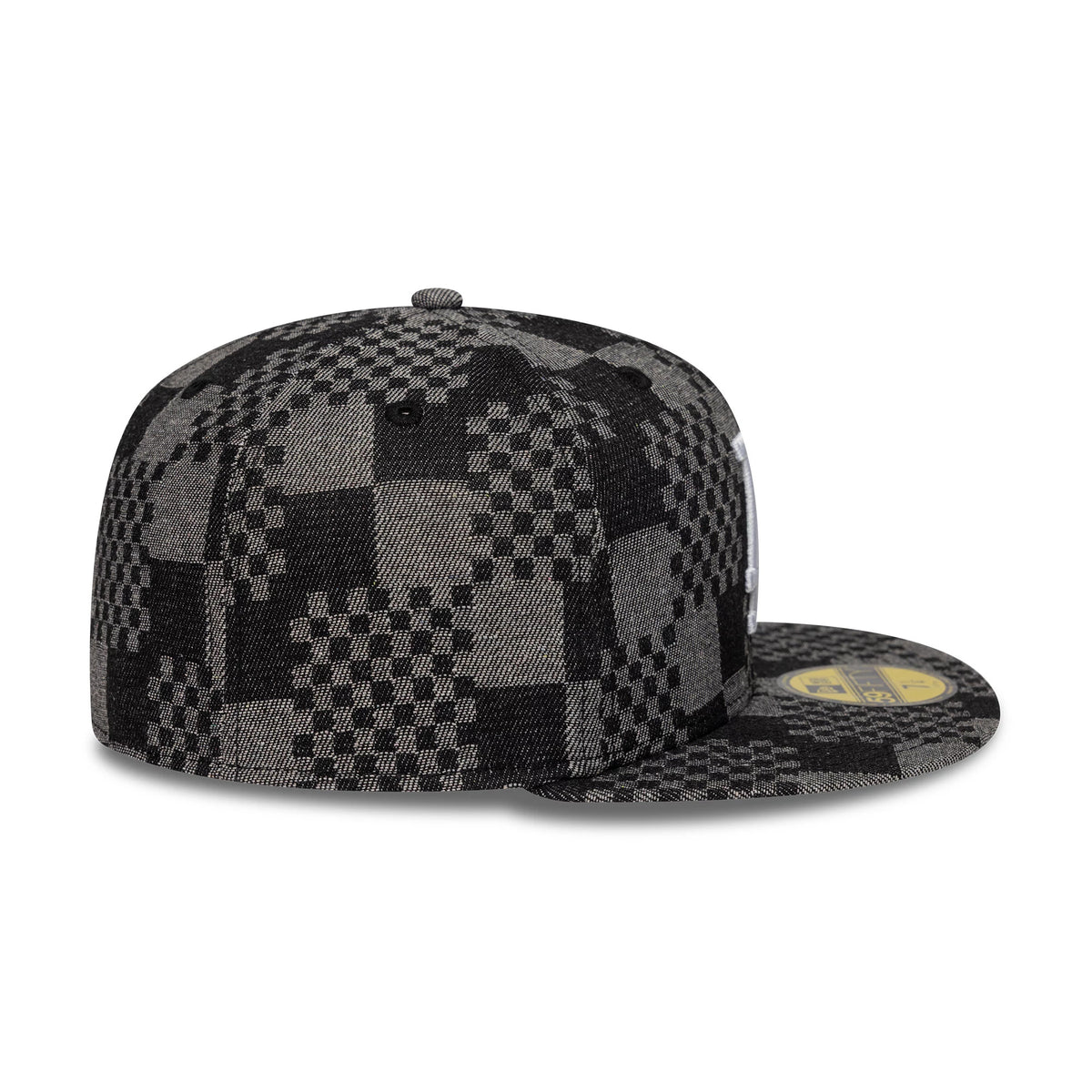 LA Dodgers MLB Denim Black New Era 59FIFTY Fitted Cap, side view showing a grey and black checkerboard pattern covering the structured crown and flat visor, with a gold 59FIFTY size sticker on the visor and black eyelets on the crown.