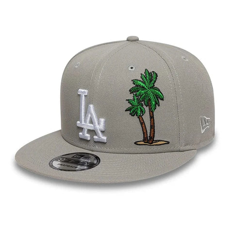 Slide 7:Gray 9FIFTY cap with LA Dodgers logo and palm tree design on a white background