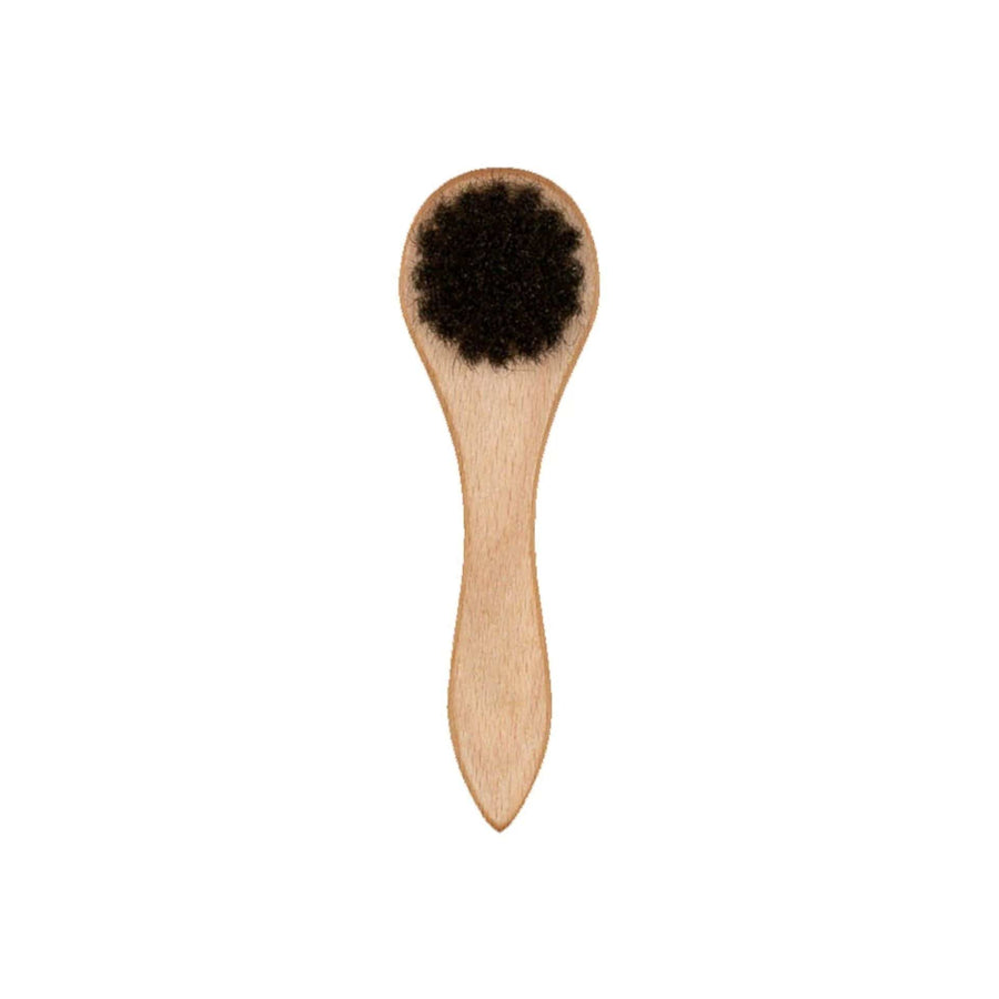 This is a New Era Wooden Cap Brush 2