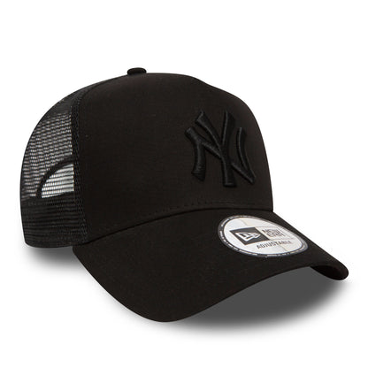 New York Yankees Clean Black On Black A-Frame Trucker Cap, three-quarter view showing the raised black embroidered NY logo on the front panel, with a mesh rear and a New Era adjustable sticker on the curved visor.