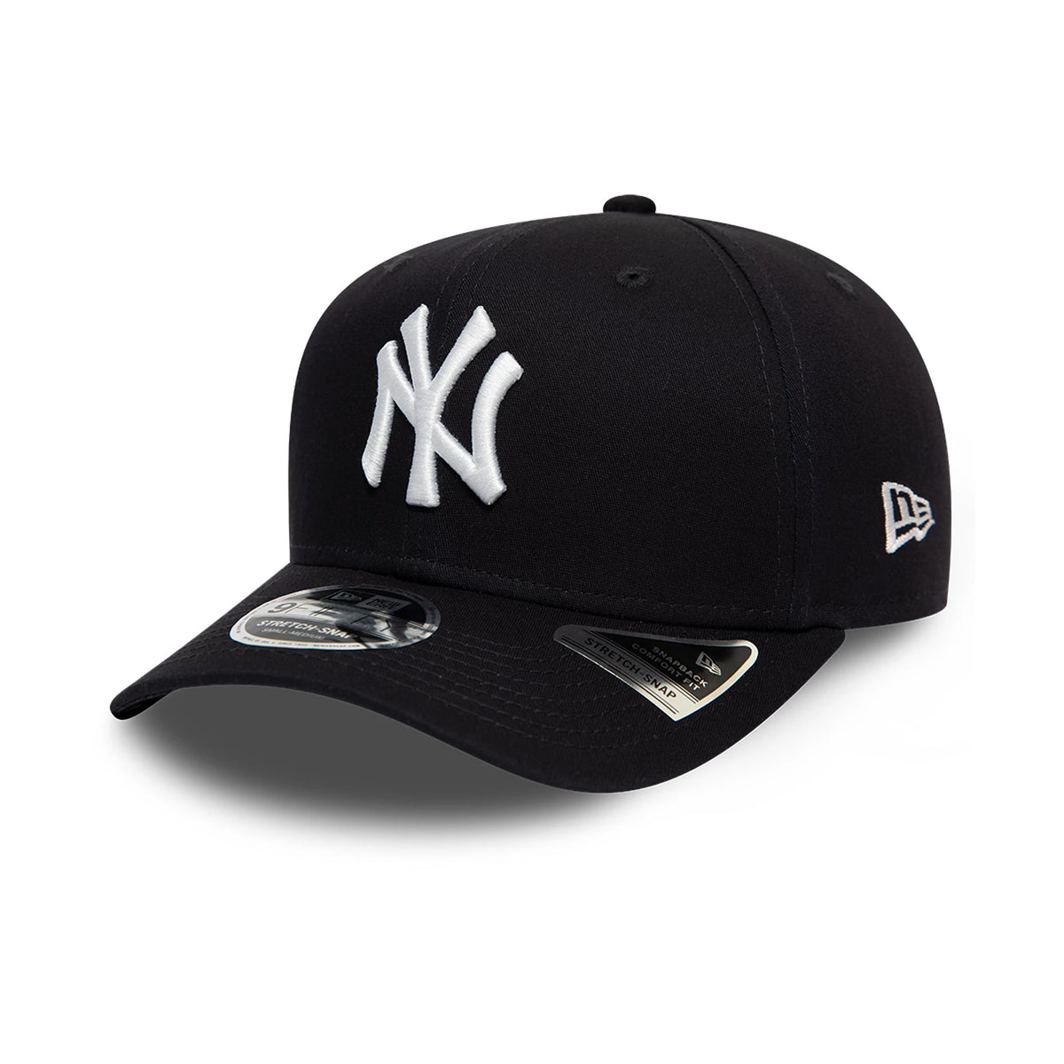 New York Yankees Navy New Era 9FIFTY Stretch Snap Cap, three-quarter view showing the raised white NY logo on the front panel, matching navy curved visor with a 9FIFTY size sticker, and white New Era flag logo on the left side.