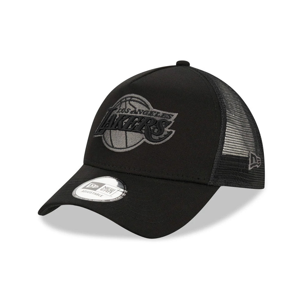 LA Lakers Tonal Black New Era A-Frame Trucker Cap, three-quarter view showing the raised tonal Lakers logo on the front panel, black mesh side panels with the New Era flag logo, and a 9FORTY size sticker on the black curved visor.
