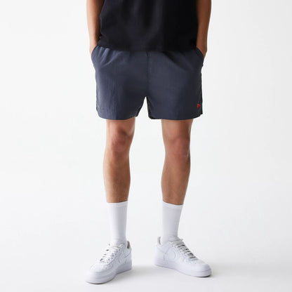 The Male model is wearing Hermanos Koumori x New Era Dark Grey Shorts 7