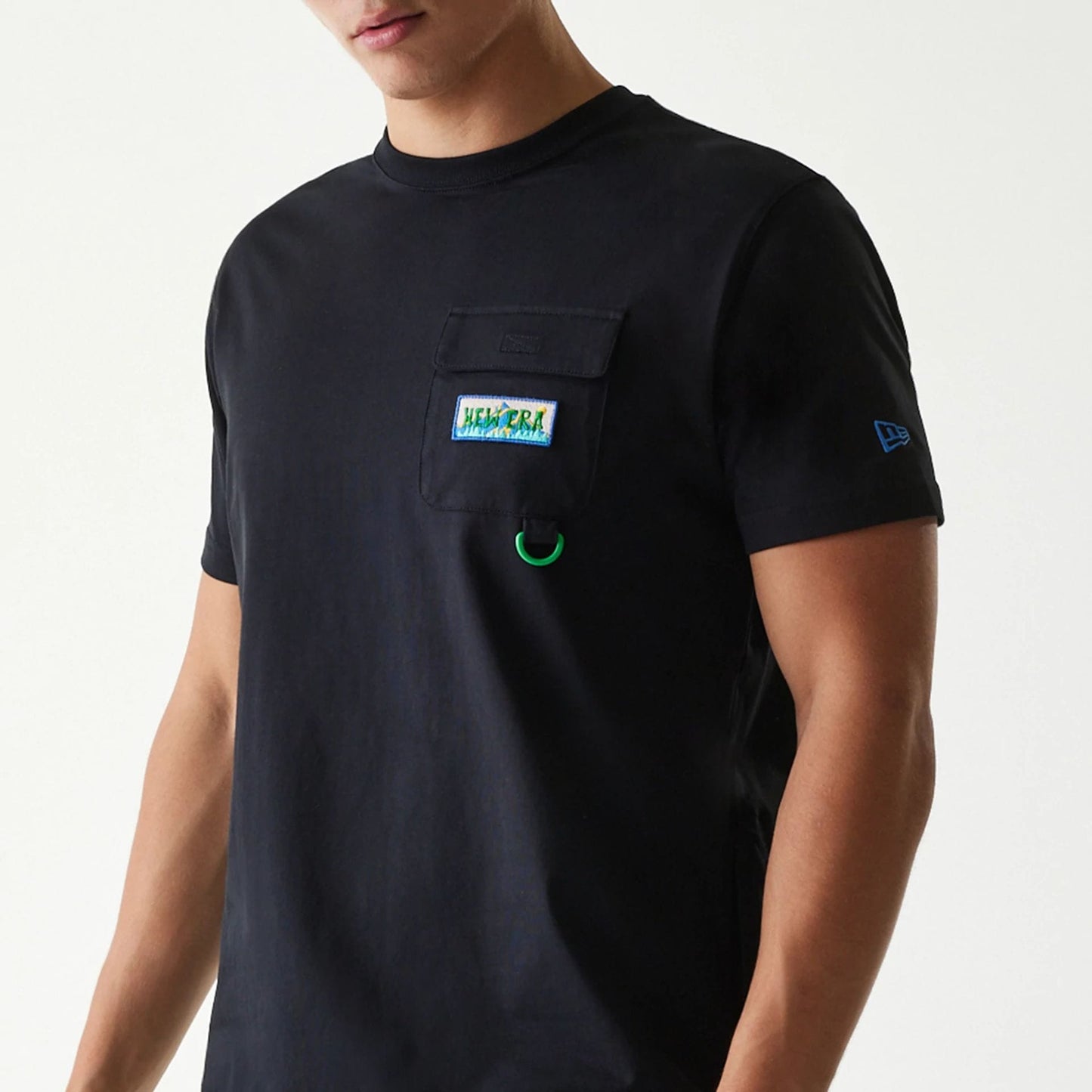 The Male model is wearing New Era Outdoor Earth Day Black Side Pocket T-Shirt 3