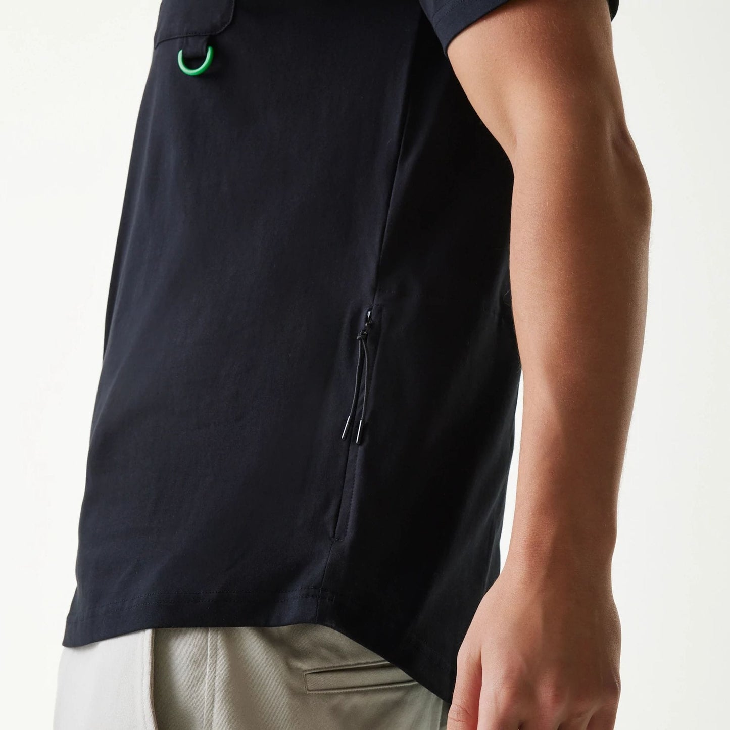 The Male model is wearing New Era Outdoor Earth Day Black Side Pocket T-Shirt 4