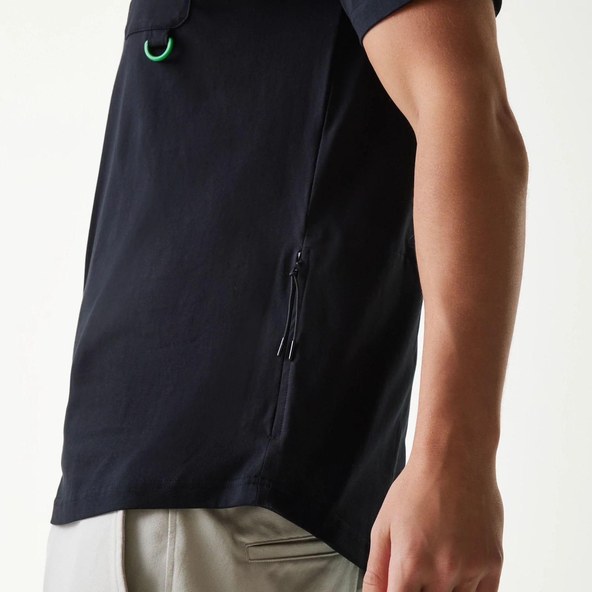 The Male model is wearing New Era Outdoor Earth Day Black Side Pocket T-Shirt 4