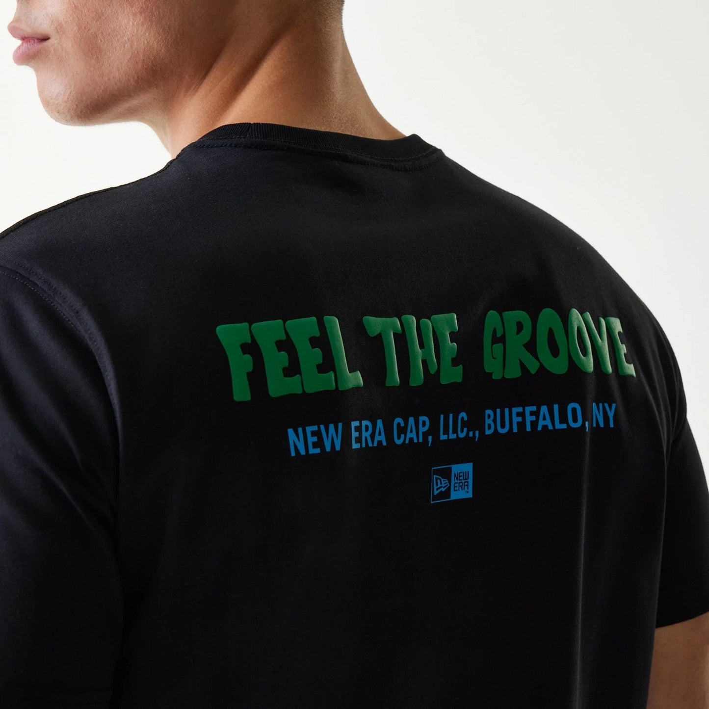 The Male model is wearing New Era Outdoor Earth Day Black Side Pocket T-Shirt 5